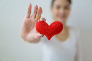 woman showing a heart