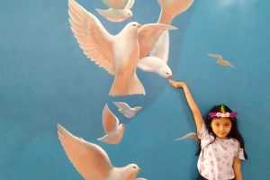 child with doves